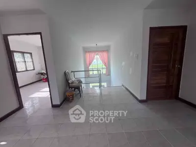 Spacious hallway with natural light and elegant decor