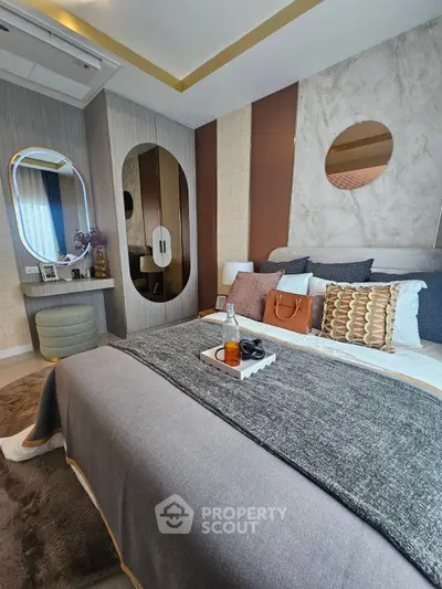 Luxurious bedroom with modern decor and elegant furnishings, featuring a cozy bed and stylish accents.