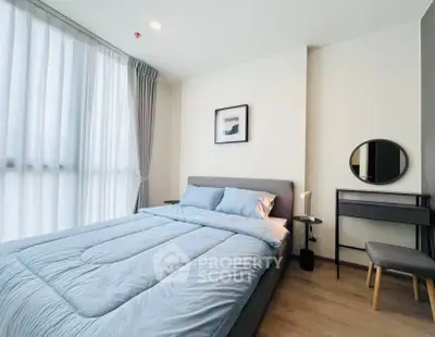 Modern bedroom with stylish decor and natural light