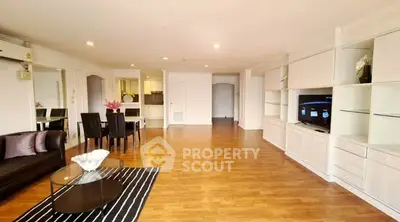Spacious living room with modern furniture and open layout, perfect for entertaining.
