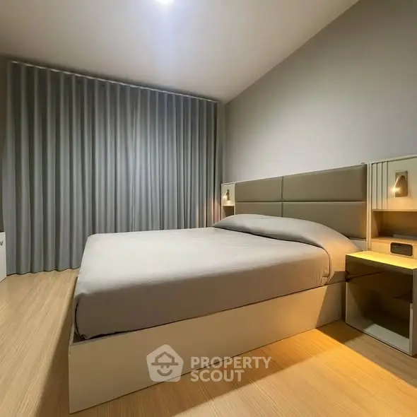 Modern minimalist bedroom with cozy lighting and sleek design