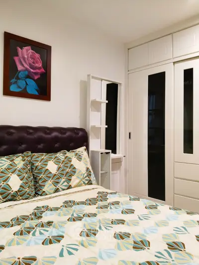 Cozy bedroom with stylish decor and ample storage space