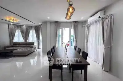 Spacious modern living room with elegant dining area and stylish lighting