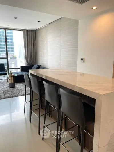 Luxurious modern living room with sleek marble bar counter and city view, perfect for entertaining.