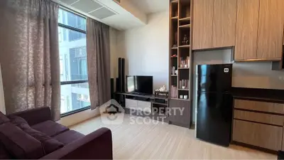 Modern living room with large window and sleek entertainment center