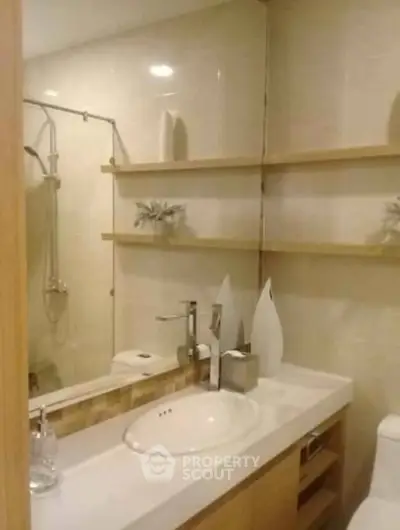 Modern bathroom with elegant fixtures and stylish shelving