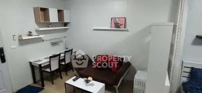 Cozy living room with modern decor and compact furniture, perfect for urban living.
