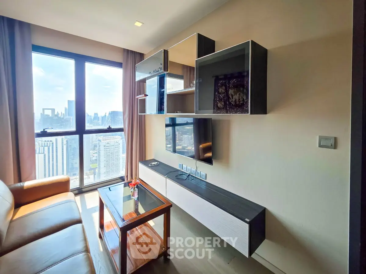 Modern living room with stunning city view and stylish wall-mounted TV unit.