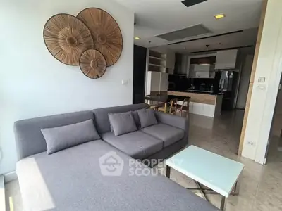 Modern living room with stylish decor and open kitchen layout