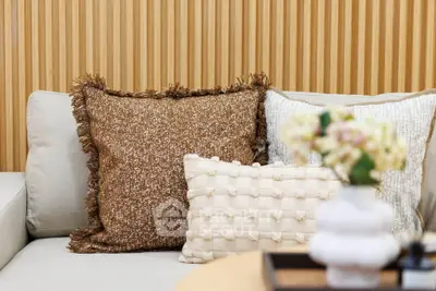 Stylish modern living room with textured cushions and elegant decor