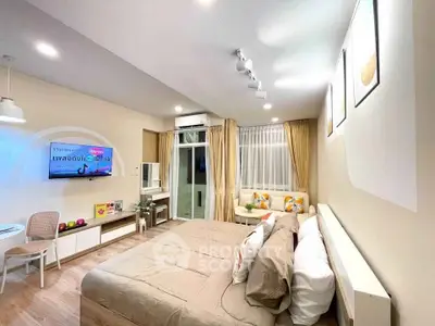 Spacious modern bedroom with stylish decor and natural light
