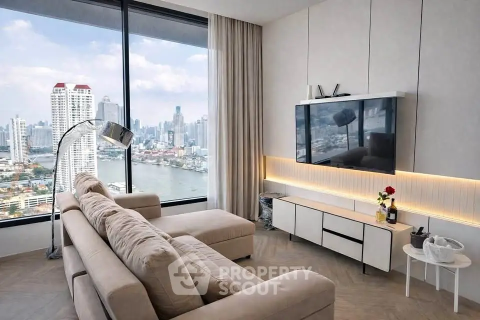 Luxurious living room with stunning city view, modern decor, and large windows in high-rise apartment.