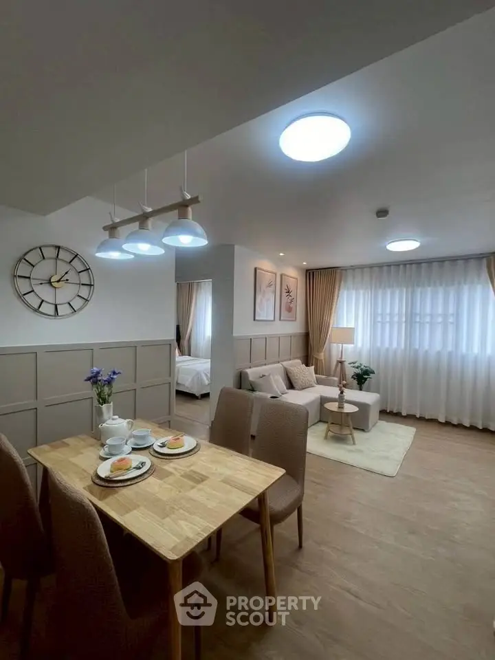 Modern open-plan living and dining area with stylish decor and natural light