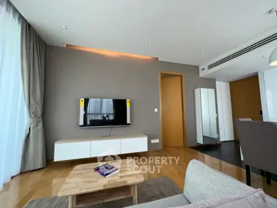 Modern living room with sleek TV setup and stylish furniture