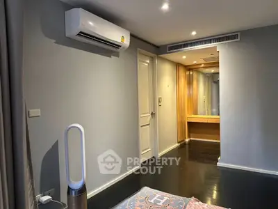 Modern bedroom with air conditioning and sleek flooring