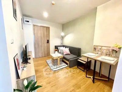 Cozy living room with modern decor and dining area, perfect for urban living.