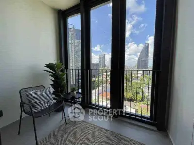 Modern balcony with city skyline view, featuring stylish seating and lush greenery.