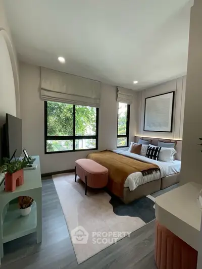 Modern bedroom with large windows and stylish decor