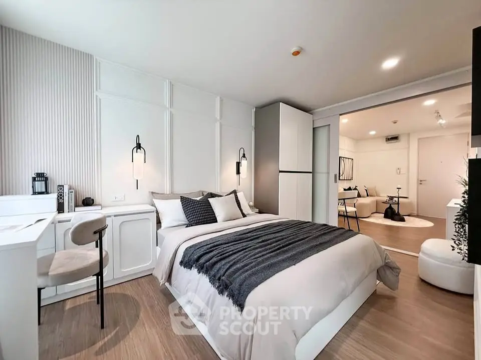 Modern bedroom with stylish decor and open layout in a contemporary apartment.