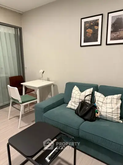 Modern living room with teal sofa and minimalist decor