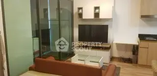 Modern living room with sleek TV setup and stylish furniture