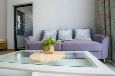 Charming living room with cozy sofa and stylish decor