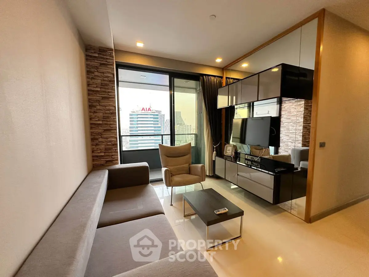 Modern living room with sleek furniture and city view balcony in luxury apartment.