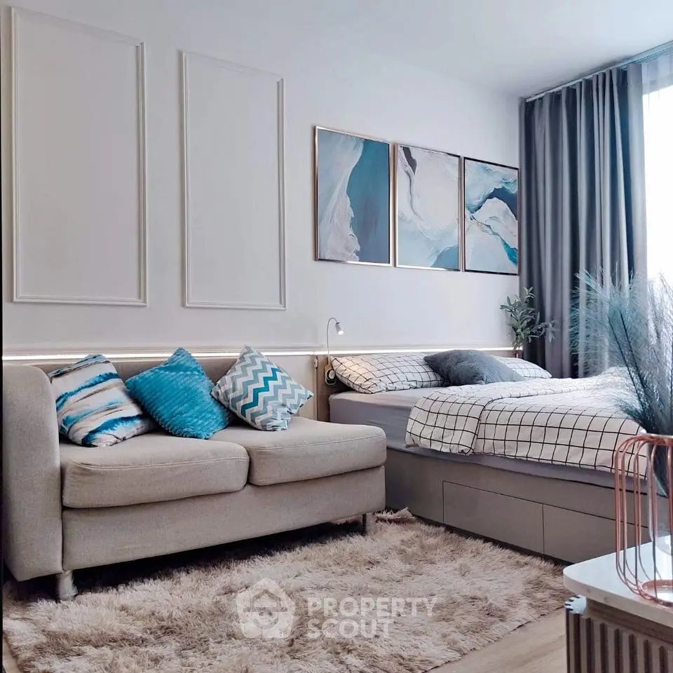 Modern bedroom with cozy sofa and stylish decor in elegant apartment