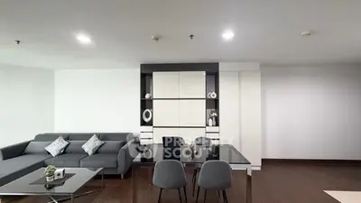 Modern living room with sleek furniture and elegant decor in a contemporary apartment.