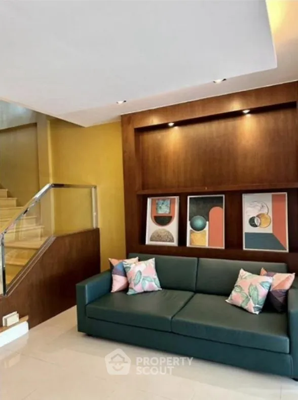 Stylish living room with modern sofa and decorative wall art