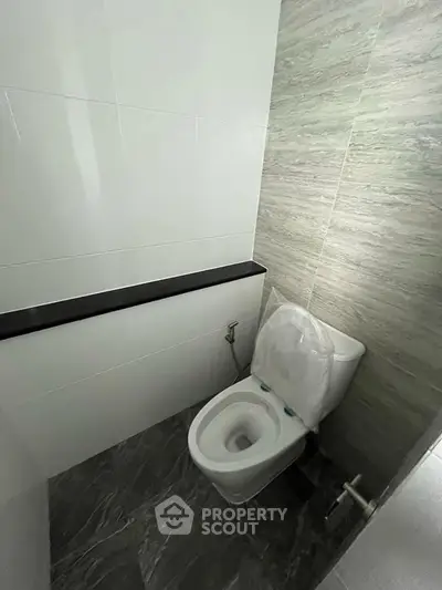 Modern bathroom with sleek design and high-quality fixtures in a contemporary real estate property.
