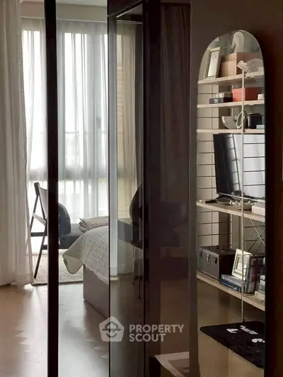 Modern bedroom with stylish decor and natural light