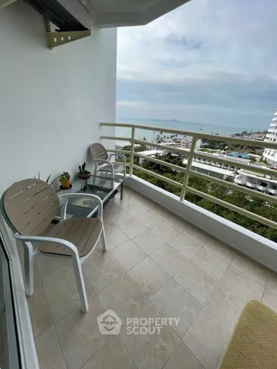 Spacious balcony with ocean view, perfect for relaxation and enjoying the scenery.