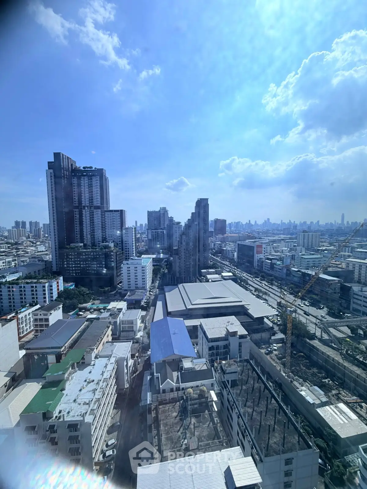 Stunning cityscape view from high-rise building, showcasing urban skyline and architectural marvels.
