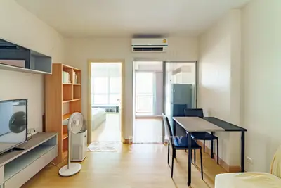 Modern living room with dining area and air conditioning in a cozy apartment