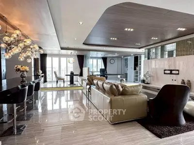 Luxurious open-plan living room with modern decor and stunning city views.