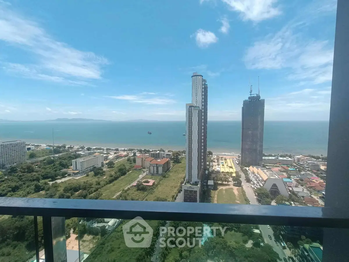 Stunning high-rise ocean view from a modern balcony, perfect for luxury living.