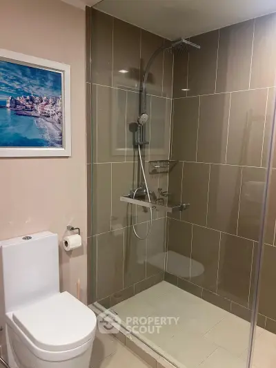 Modern bathroom with glass shower and sleek tile design