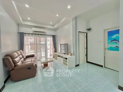 Spacious living room with modern decor and natural light