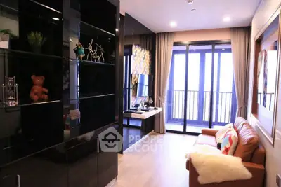 Modern living room with balcony, stylish decor, and cozy seating area