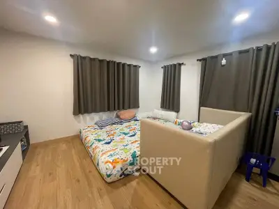 Cozy bedroom with playful decor and comfortable bedding