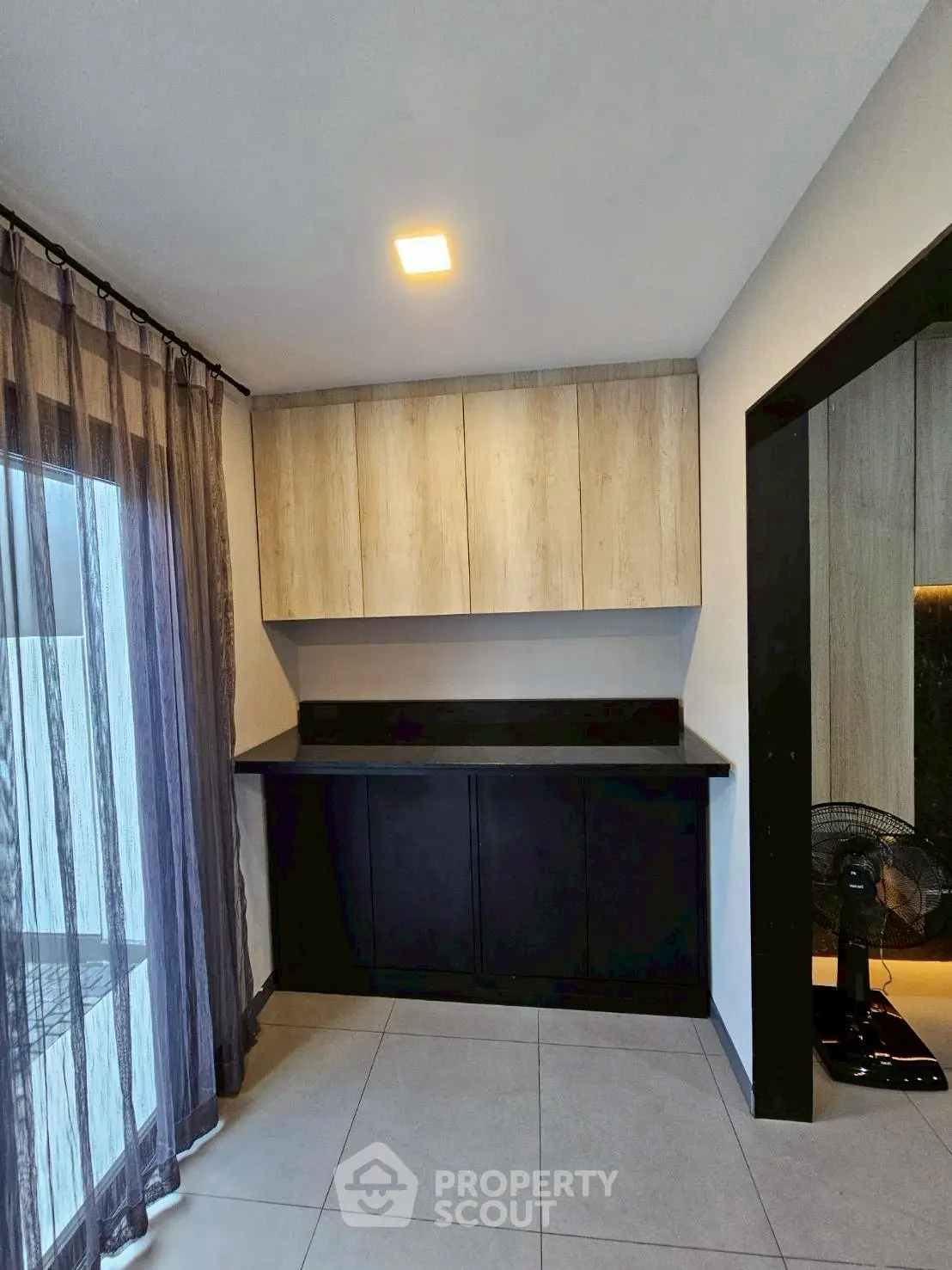 Modern kitchen corner with sleek cabinetry and ambient lighting
