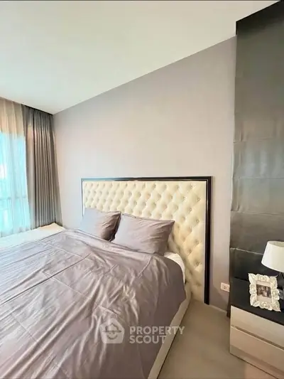 Luxurious bedroom with elegant tufted headboard and soft lighting