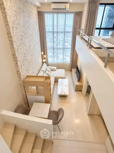 Luxurious loft apartment with high ceilings and stunning city view, featuring modern open-plan living area and stylish decor.