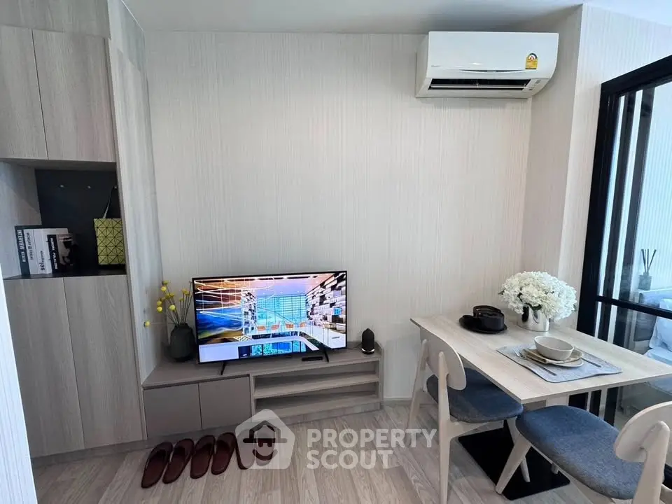 Modern living room with sleek furniture and air conditioning, perfect for cozy living.