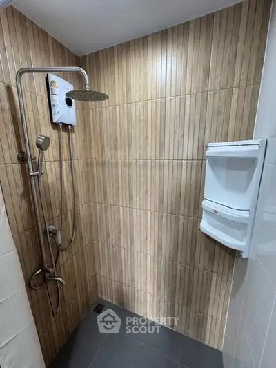 Modern bathroom with sleek shower design and wooden tile accents