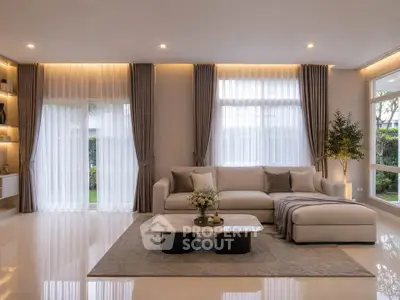 Luxurious living room with elegant decor and large windows offering natural light.