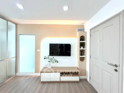 Modern living room with sleek TV unit and elegant decor