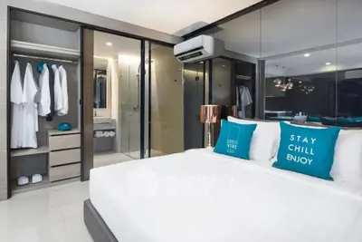 Modern bedroom with mirrored wardrobe and stylish decor