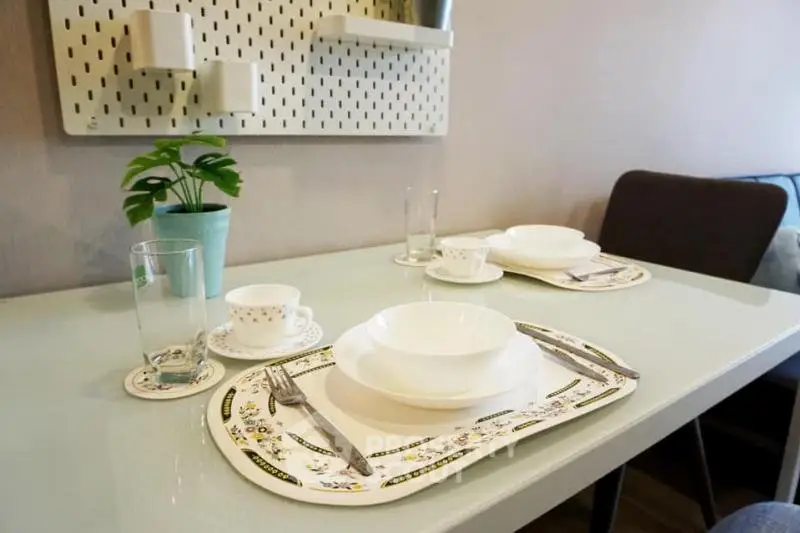 Modern dining area with elegant table setting and stylish decor